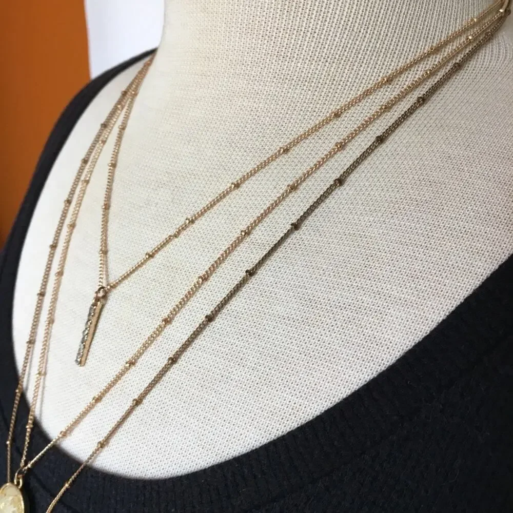 Boho gold tone three strand layered necklace